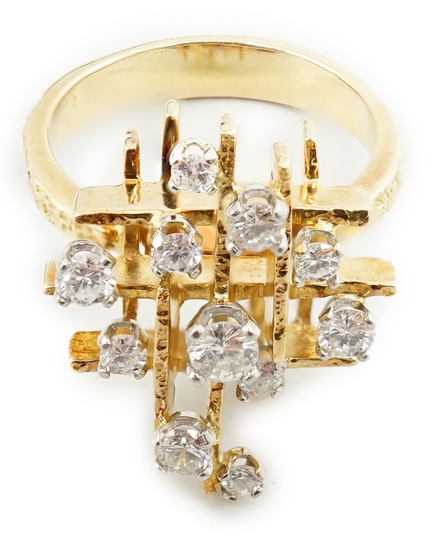 A 1970's 18ct gold and graduated diamond cluster set modernist ring